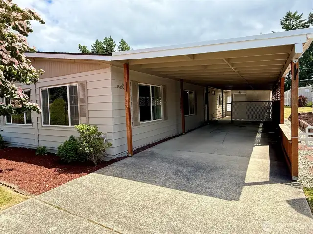Back outside, a view of the oversized carport.