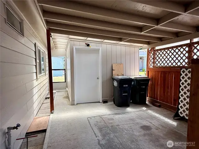 More of the carport with a view of the storage building.