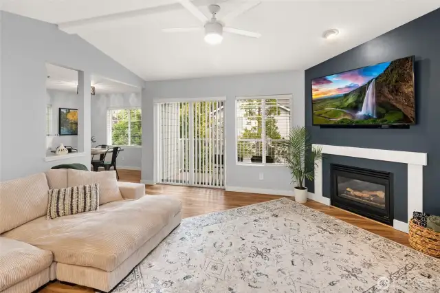 Spacious Livingroom with gas fireplace and abundant natural light