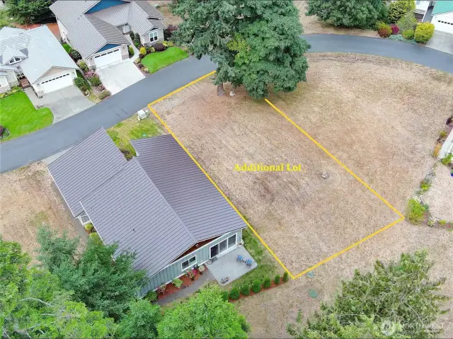 Additional lot to preserve privacy or hold as a future investment.