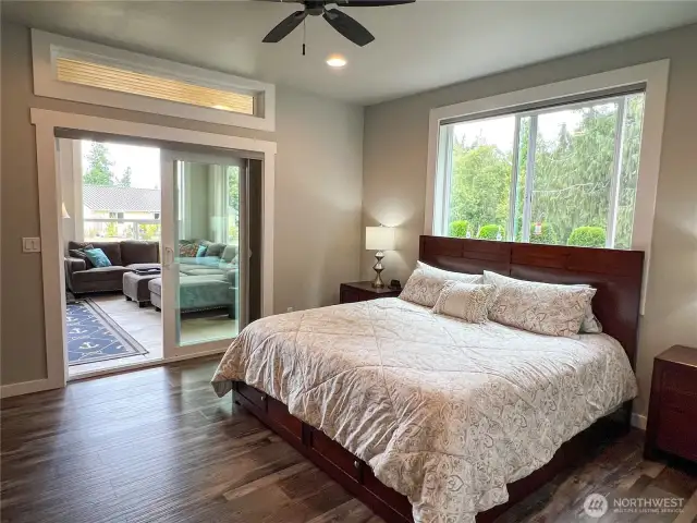 Primary suite opens to sunroom.