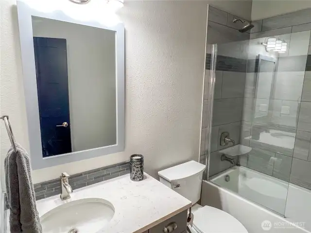 Second bathroom with bathtub.