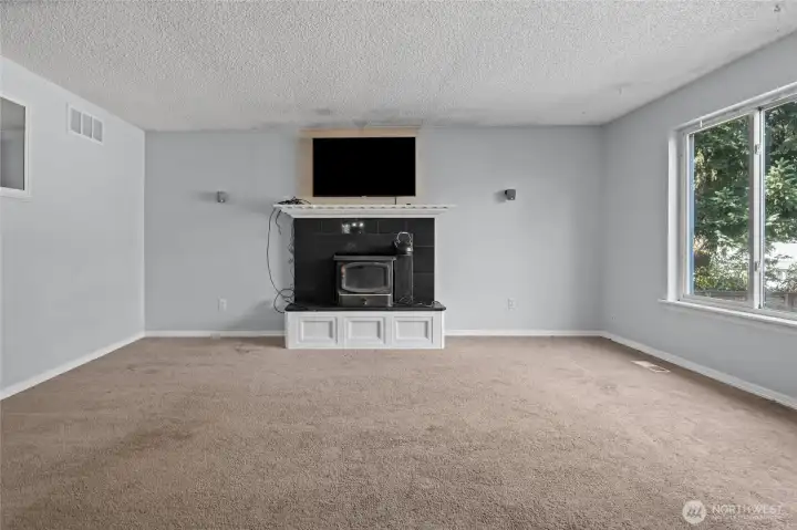 Cozy up to the wood burning fireplace insert during our winter months.