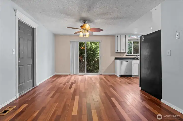 Large dining room is ready for entertaining with beautiful engineered hardwood floors!