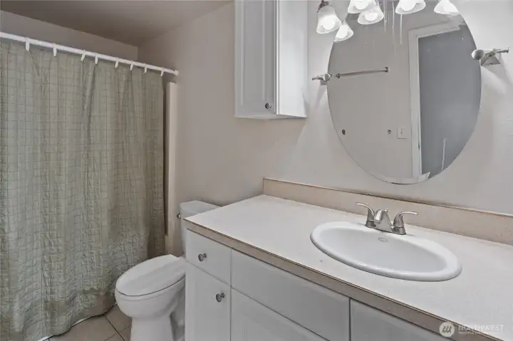 Main bath offers tub.