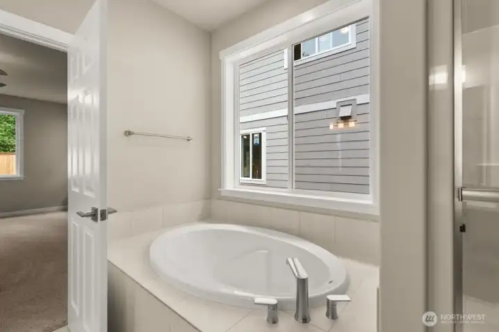 Large soaking tub with tile deck