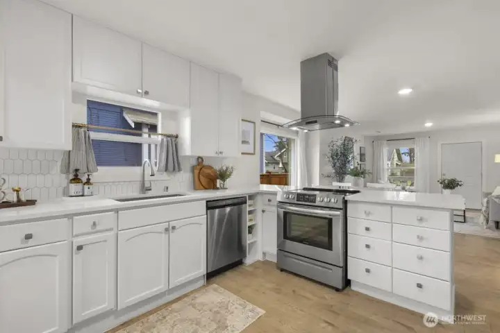 Kitchen with tile backsplash and SS appliances
