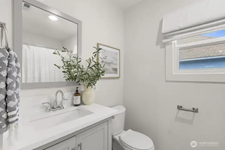 Full bathroom situated between the bedrooms