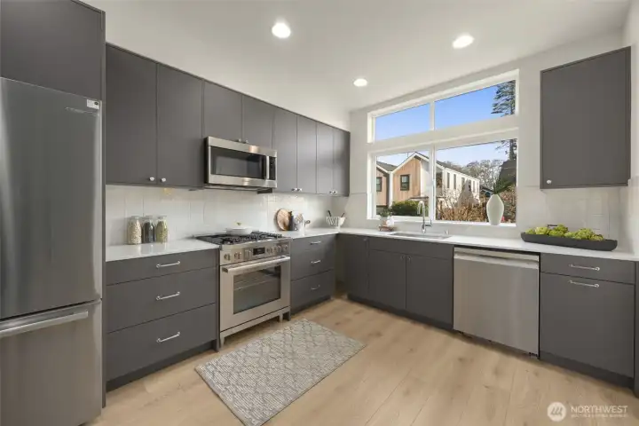 A chef-inspired kitchen featuring handcrafted cabinetry and a professional-grade stainless steel appliance suite