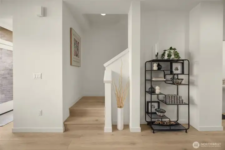 Modern elegance defined by two-tone cabinetry and designer tile work that elevates everyday routines