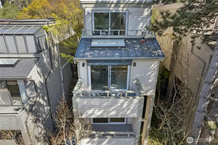 Cedar sided. Metal roof and flat roof recently replaced