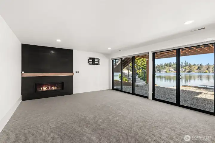 Lower Level Rec Room with Fireplace and slider to lake side