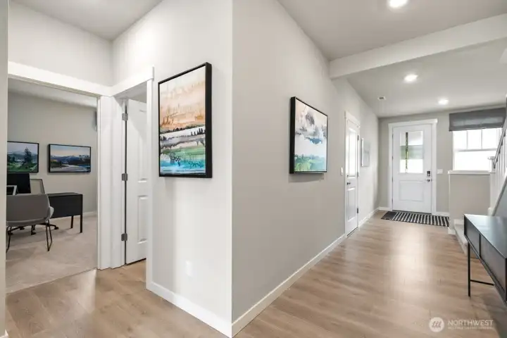 Check out the wide hallway leading into spacious great room. Photos are representational. Actual colors and finishes will vary. See site agent for details.