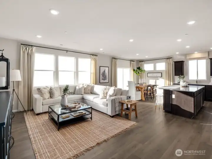 Another great view of the great room.  Wow, check out all the windows. Photos are representational. Actual colors and finishes will vary. See site agent for details.