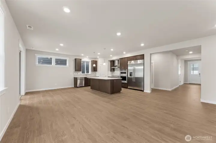Great photo showcasing large open concept great room. Actual home is under construction and materials, colors, and finishes will vary. See site agent for details.