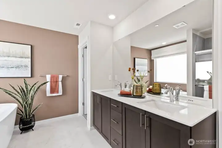 Double vanity sink in the primary bathroom. Photos are representational. Actual colors and finishes will vary. See site agent for details.