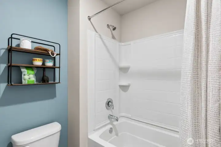 Shower and sink are separated by the door to accommodate multiple people getting ready at the same time. Photos are representational. Actual colors and finishes will vary. See site agent for details.