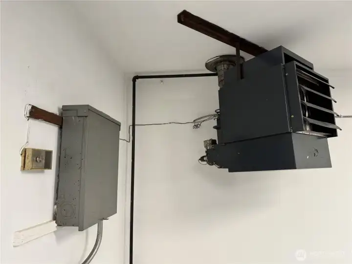 Garage furnace. Thermostat controlled. Great for the colder days and nights.