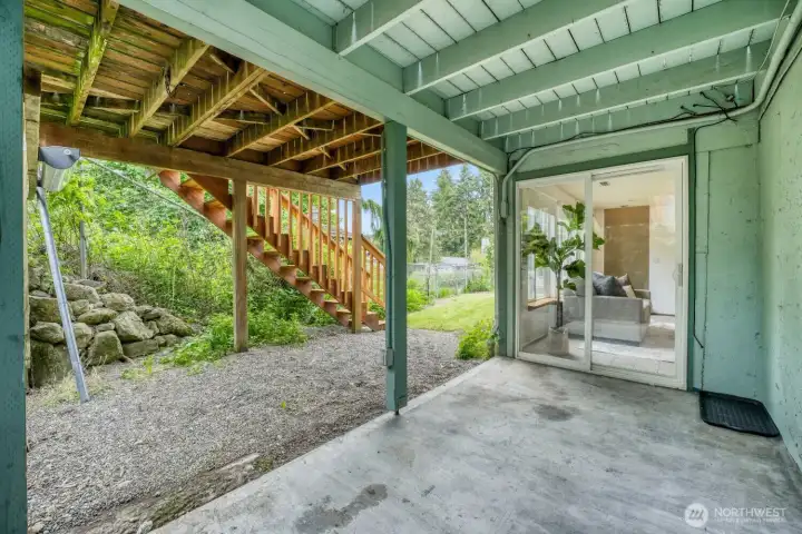 Lower level covered patio offers a private entrance to the lower level, convenient for a MIL or potential income suite.