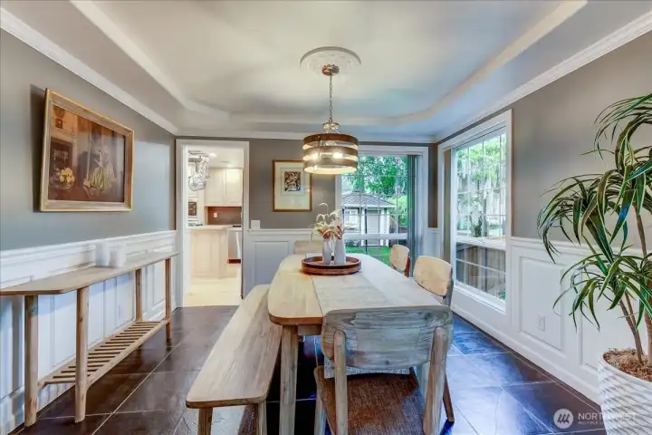Open-concept dining room seamlessly flowing from the living area and kitchen.