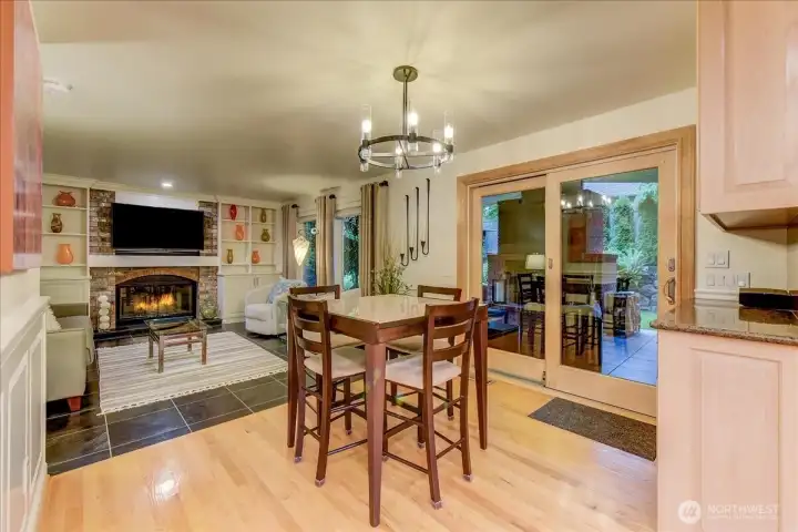 Dining area adjacent to the kitchen, featuring convenient sliding glass doors that lead directly to the rear living space.