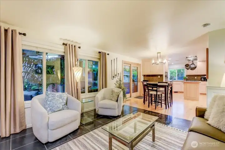 Large windows offering expansive views of the stunning outdoor living area.