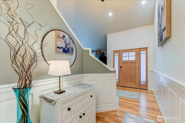 Bright, inviting hallway leading to the front entryway.