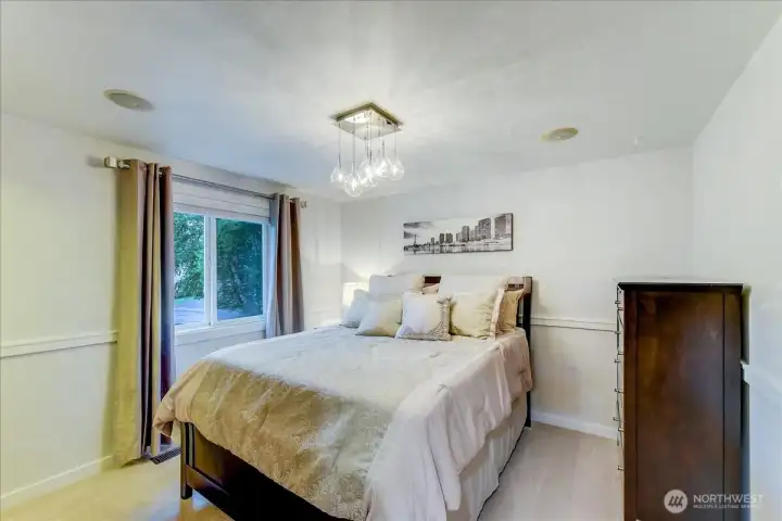 Guest room features a spacious walk-in closet and home includes all existing window treatments.