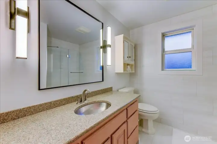 Main full bathroom located on the upper level.
