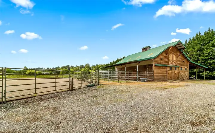 Arena at left, barn at right