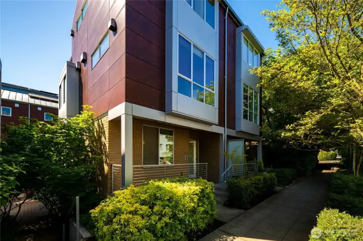 Corner unit on tree-lined residential street