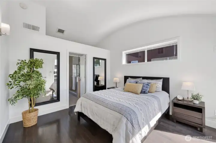 Primary bedroom with loft area above
