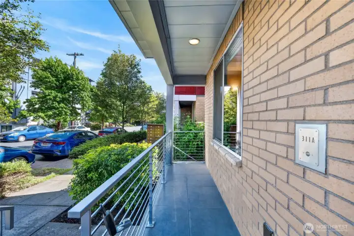 Front porch along tree-lined, residential street
