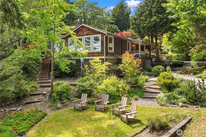 The charm grabs your attention the moment you arrive. Plus, you have the rare opportunity to enjoy the privacy of a "beach" home that isn't impacted by the tides while owning 218 feet of waterfront across the street! The best of both worlds - gardens and the beach!! The charm grabs your attention the moment you arrive. Plus, you have the rare opportunity to enjoy the privacy of a "beach" home that isn't impacted by the tides while owning 218 feet of waterfront across the street! The best of both worlds - gardens and the beach!!
