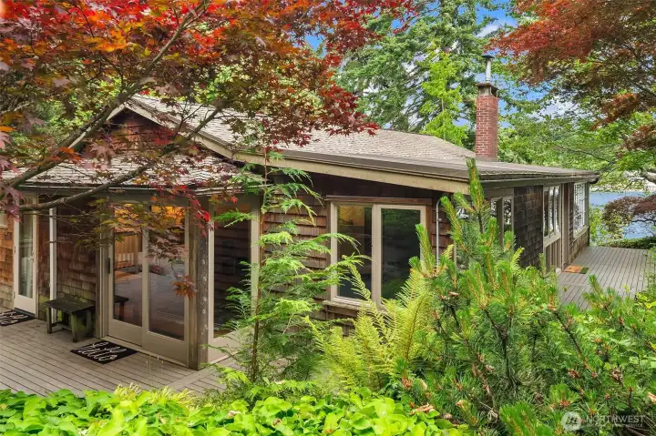 Newly finished Trex decking surrounds two sides of the home and allows for setting up al fresco dining whenever the mood strikes. Newly finished Trex decking surrounds two sides of the home and allows for setting up al fresco dining whenever the mood strikes.