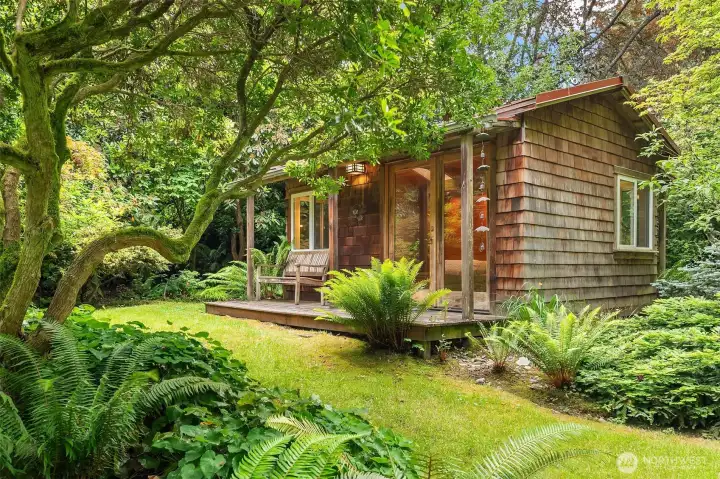 Up a winding pathway, find the adorable guest studio hidden among majestic maples and rhododendrons. Up a winding pathway, find the adorable guest studio hidden among majestic maples and rhododendrons.