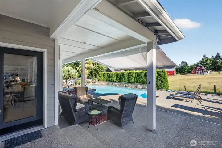 Retractable awning provides added shade for those bright days by the pool.