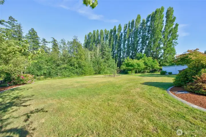 A corner lot that is discreetly set back off the road.