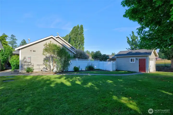 Tool shed is located in the side yard.