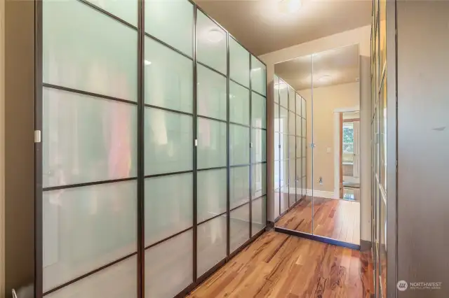 Walk-in closet for primary suite.  There is a great deal of storage in this home!