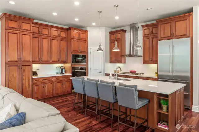 This updated kitchen features beautiful cabinetry, subway white tile and pretty quartz countertops.  Luxury appliances- they are all Miehle.