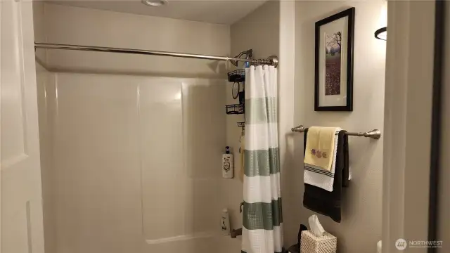 Guest bathroom is located between the 2 guest rooms on the West end of the home.