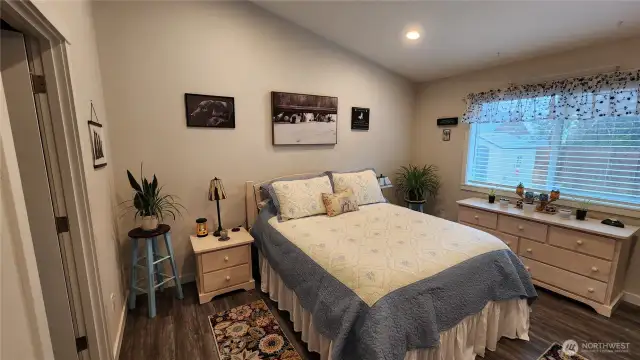 This is a California King size bed with still plenty of room for dressers and side tables.