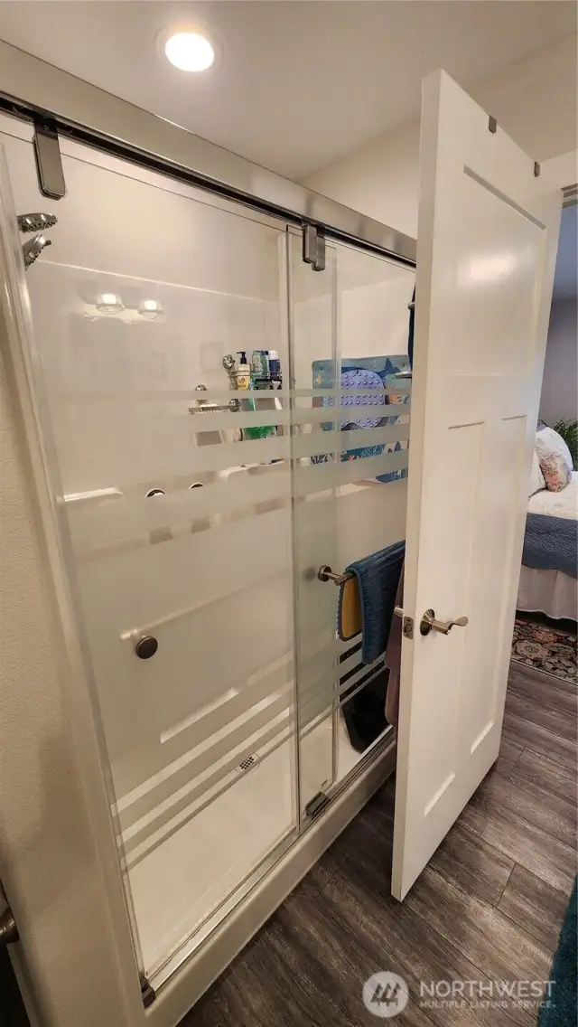 Note the beautiful, custom shower door.