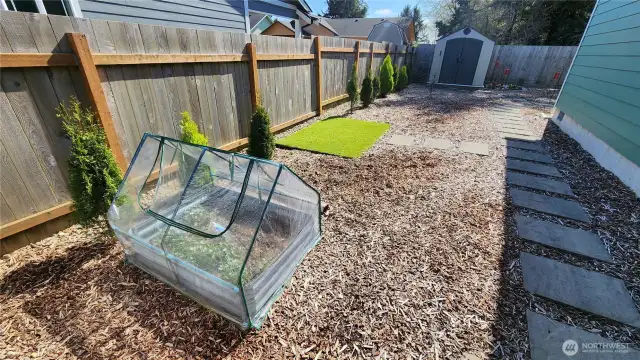 A small herb garden along the East side of the property.