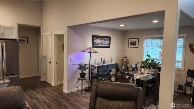 Kitchen, Living room and dining room are all open. Vaulted ceilings in kitchen and living area. First door past dining room is utility room & garage entrance. 2nd door is pantry and 2 bedrooms are on either side of hallway.