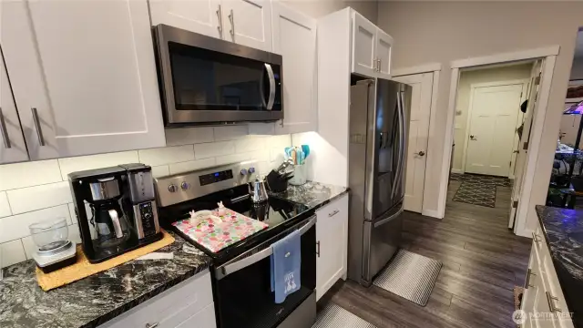 The utility room and garage entrance are conveniently just off the kitchen.
