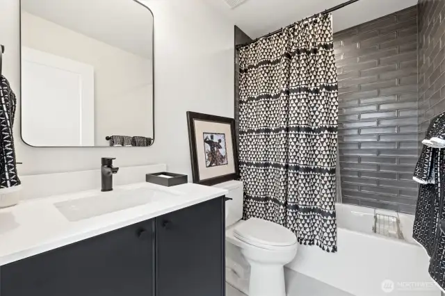 Second bathroom with designer tile finishes.