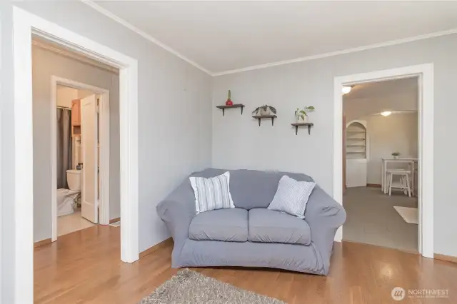 Such a warm and cozy feeling, entrance to bedrooms and kitchen right off the living room!