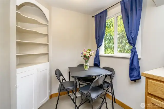 Tucked just off the kitchen, this cozy dining nook is perfect for slow mornings, quick bites, or weeknight dinners. Don’t miss the sweet built-in shelves—ready for your favorite cookbooks, plants, or display pieces!
